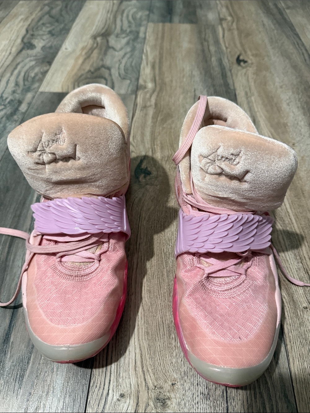 Nike Pink High-Top Sneakers with Wing Strap